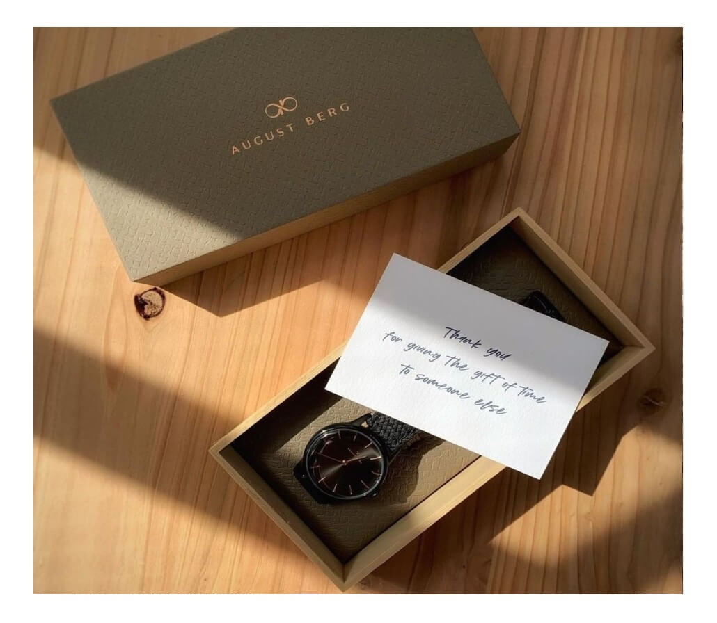 August Berg watch in an open gift box with a handwritten note